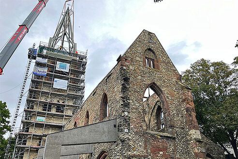 Reconstruction of the spire is put in place