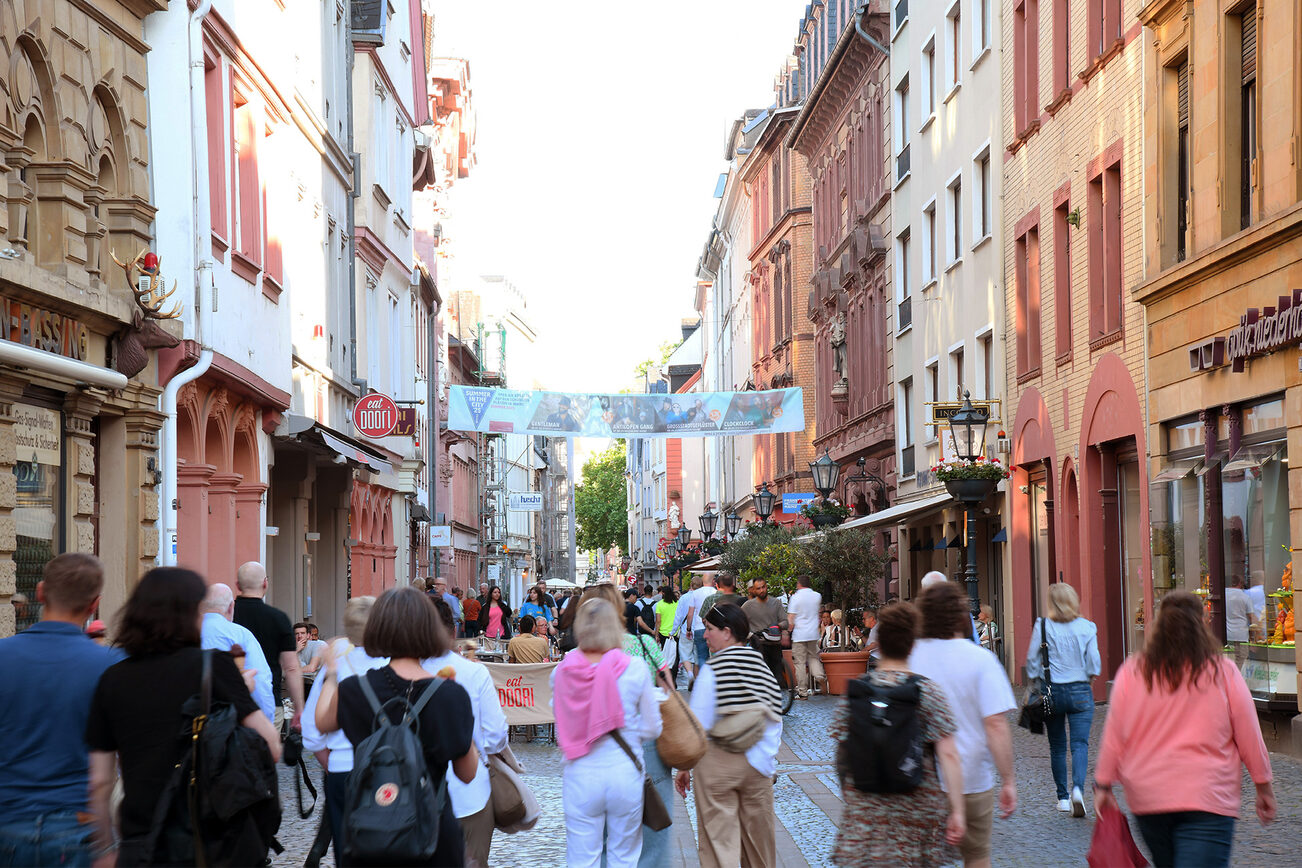 People stroll along Aufustinerstrasse